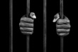 Istockphoto_10354953-hands-of-a-prisoner-on-prison-bars