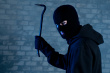 Stock-photo-16188428-criminal-raises-crowbar